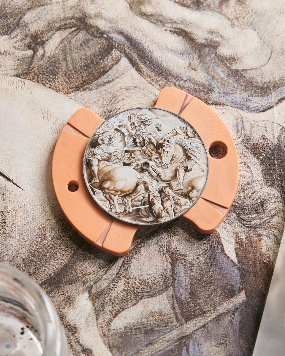 Engraved image of a horse and warrior on the dial of the watch