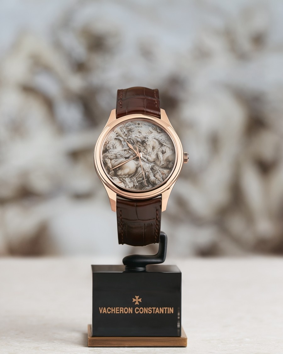 Vacheron Constantin wristwatch with a sculpted dial displayed on a stand.