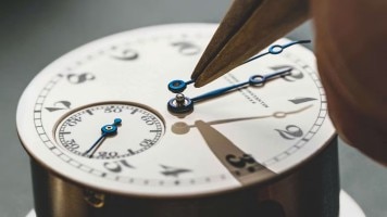 Carefully adding hands to a reborn American 1921 watch